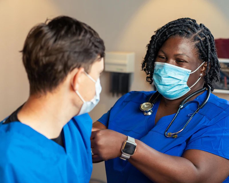 Clinician caring for a young patient